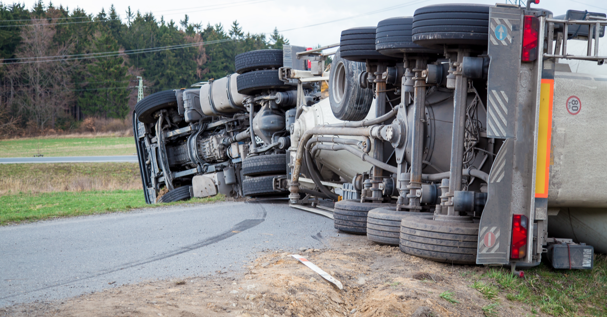 truck accident lies on road