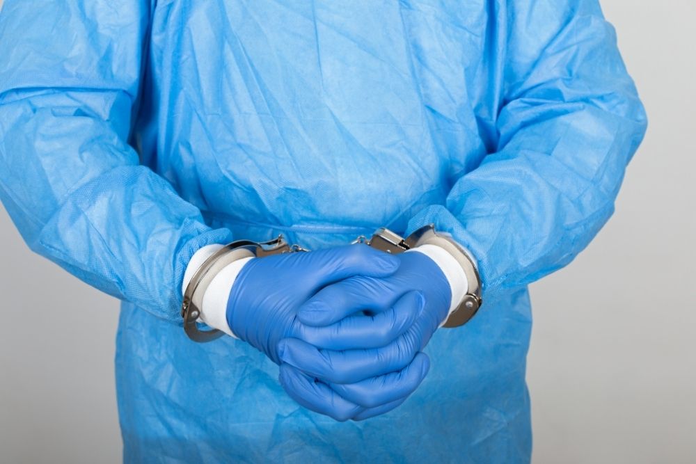 doctor with handcuffs