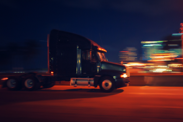 Commercial truck travelling at high speeds at night through Alpharetta, GA