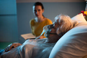 Woman taking care of a hospitalized elder